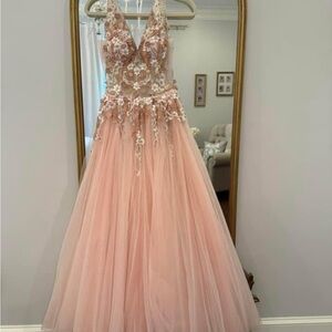 Jovani size 6 altered to a 4, hemmed. Model is 5’1 1/2” wearing 3 1/2” heel